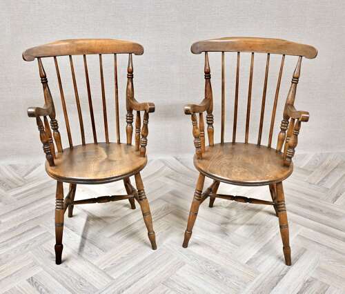 A Pair of Penny Seat Windsor Armchairs
