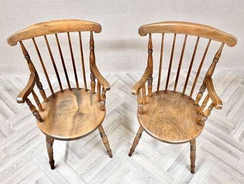 A Pair of Penny Seat Windsor Armchairs