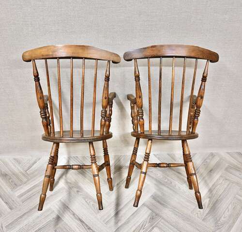 A Pair of Penny Seat Windsor Armchairs