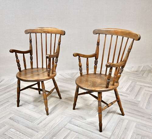 A Pair of Penny Seat Windsor Armchairs