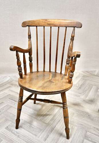 A Pair of Penny Seat Windsor Armchairs